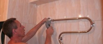 Replacing a heated towel rail in the bathroom